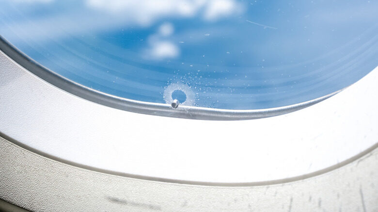 Why Airplane Windows Have Tiny Holes Explained