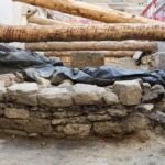 Archaeological excavation of an ancient stone and wood wall on the Île de la Cité in Paris