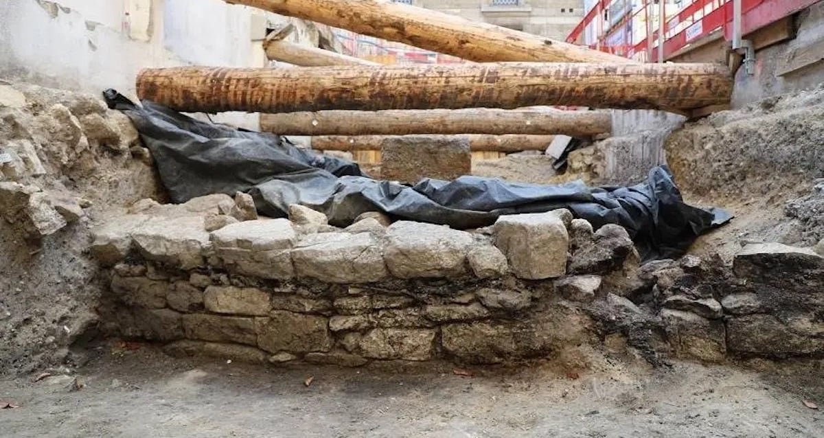 Archaeological excavation of an ancient stone and wood wall on the Île de la Cité in Paris