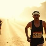 A vintage-style photograph of an Olympic marathon runner from 1904 in the early 20th century on a dusty road.