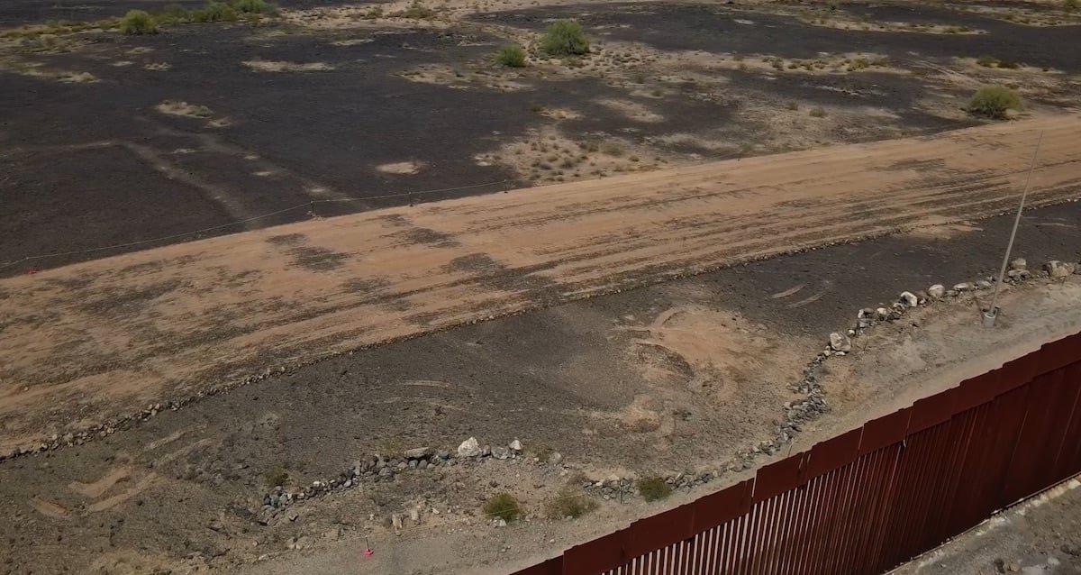 Aerial view of the Las Playas Intaglio fish carving in the Arizona desert with visible damage from machinery