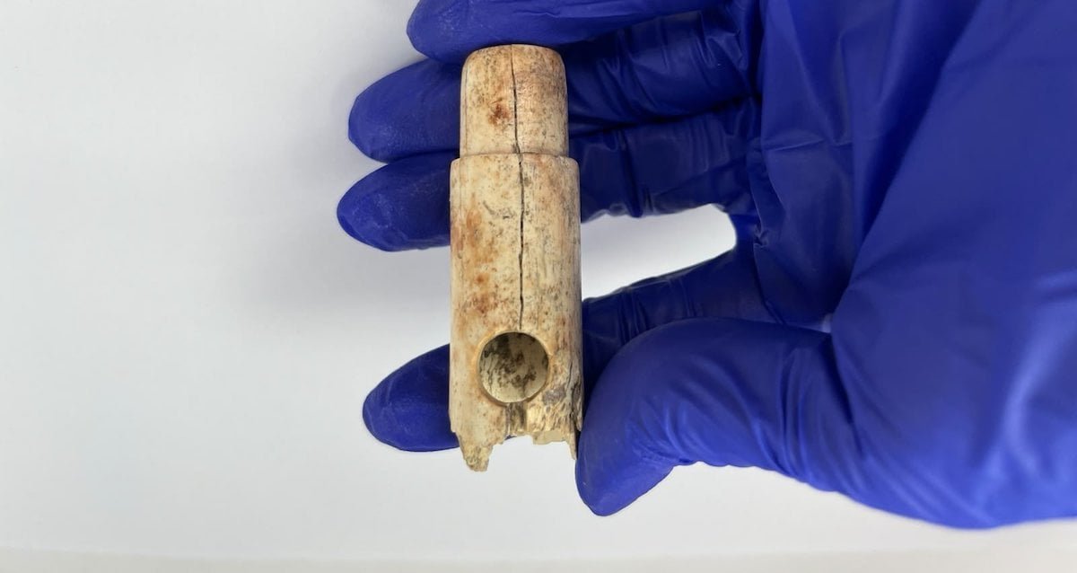 A 2,800-year-old bone flute fragment and a 4,500-year-old humanoid idol head discovered in ancient Troy