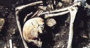 Archaeological excavation of a 1,200-year-old mass grave in Latvia showing skeletal remains