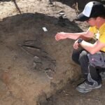Archaeological excavation of a 7,000-year-old Linear Pottery culture burial and longhouse in Leipzig