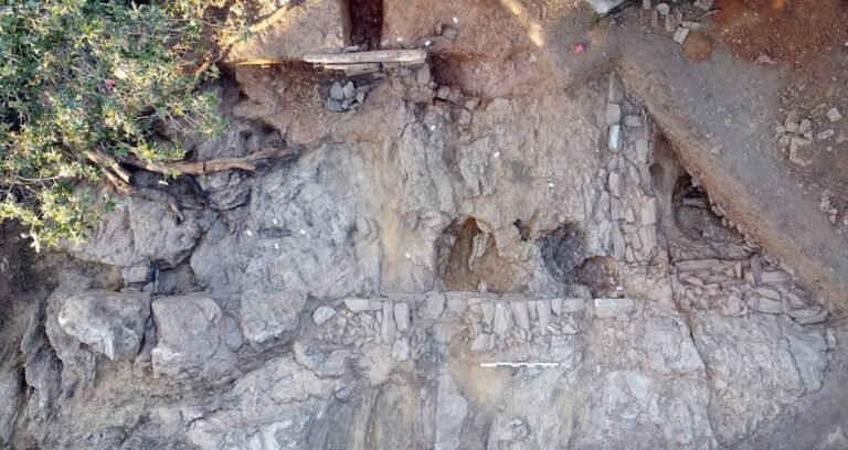 Archaeological excavation of a Roman-era house carved into schist bedrock on the coast of Corsica